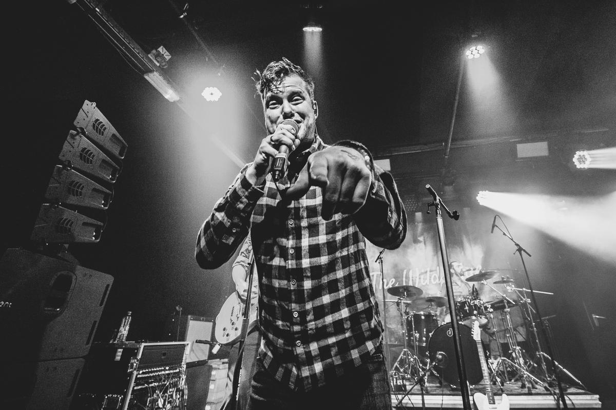 Singer with microphone, black and white