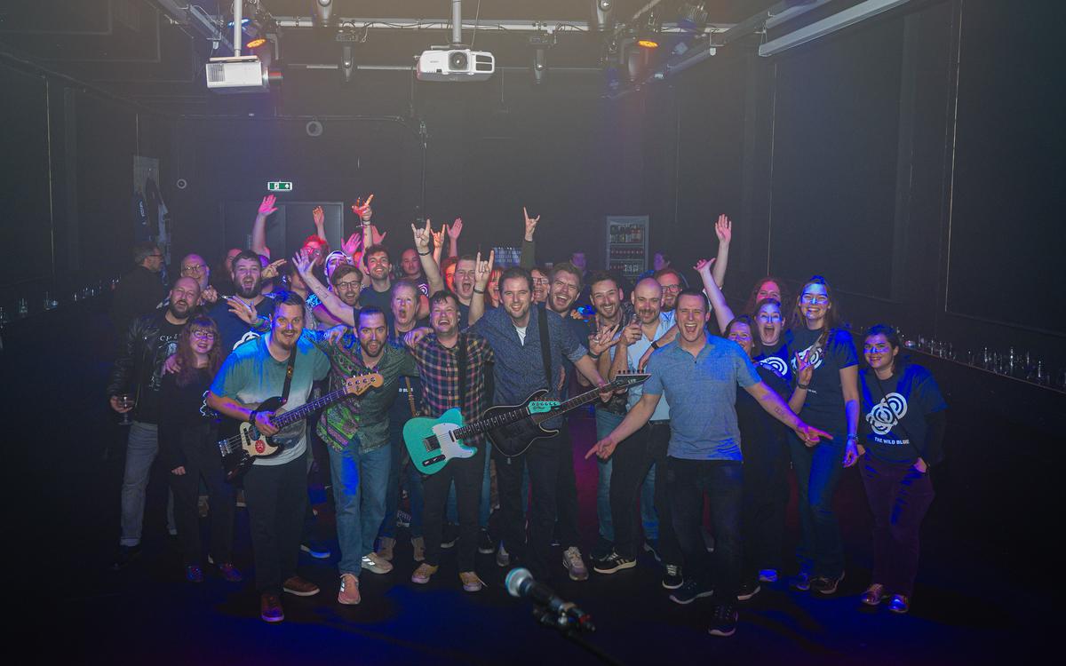 Band and audience together on stage after a show