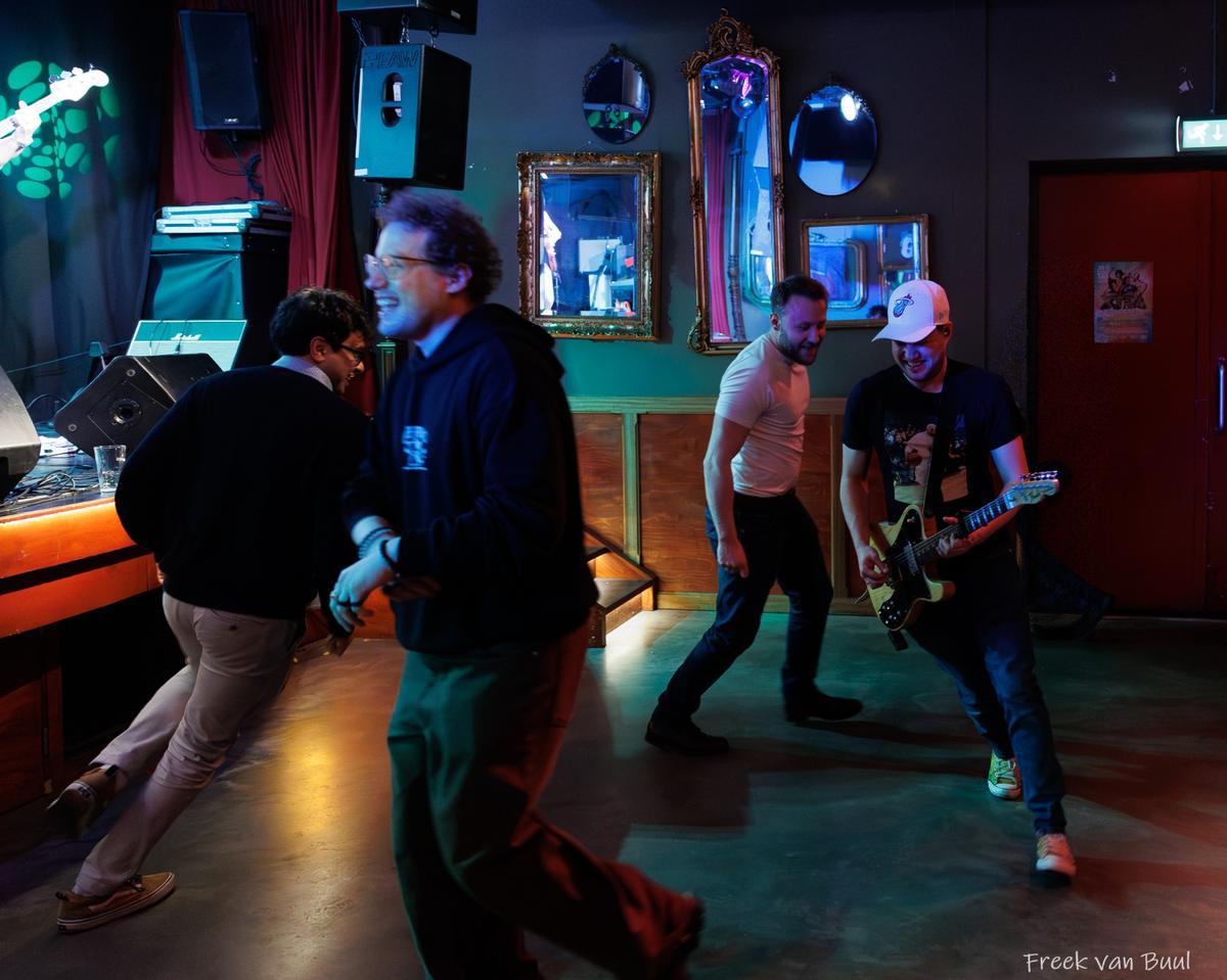 Band members playing among the crowd